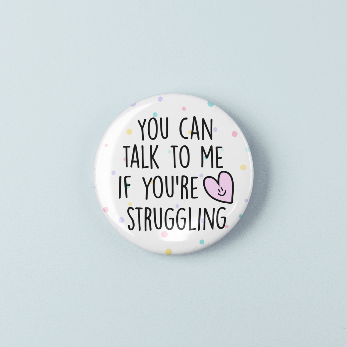 Button badge with text 'You can talk to me if you're struggling' on a light blue background