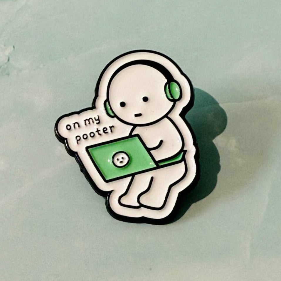 Pin with cartoon character holding a laptop and text 'on my pooster' on a light green background