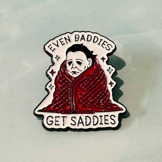 Pin with a character wearing a red scarf and text 'Even Baddies Get Saddies' on a light gray background