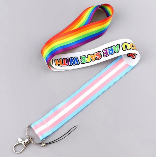 Lanyard with rainbow and striped design on a gray background