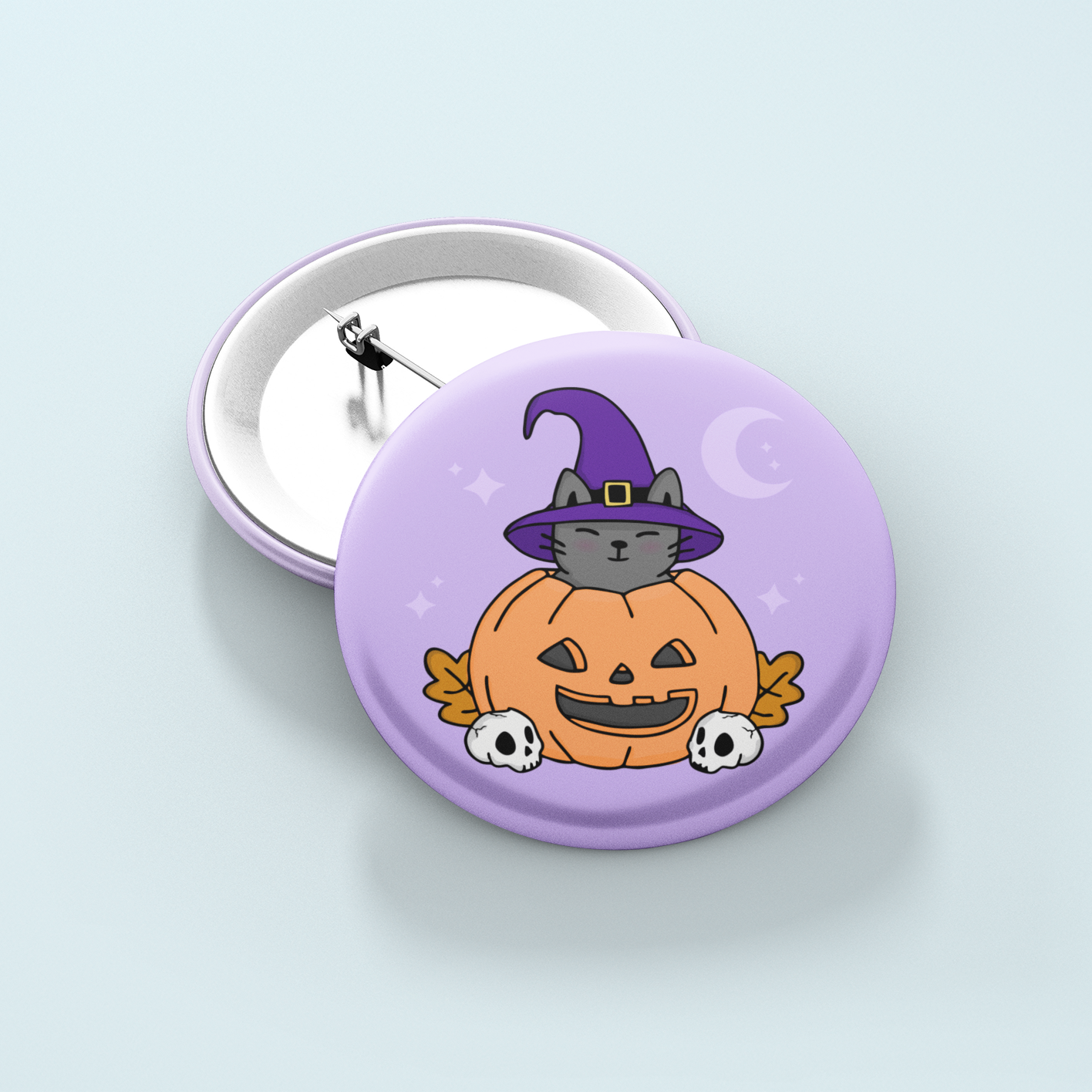 Halloween-themed button badge with a cat in a pumpkin and purple witch hat on a light purple background