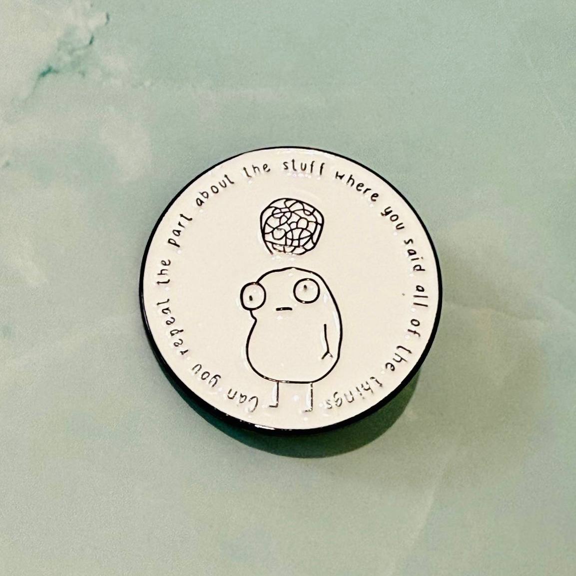 Circular object with a cartoon character and text on a light green background