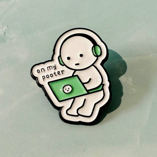 Pin with cartoon character holding a laptop and text 'on my pooster' on a light green background
