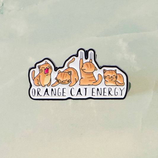 Sticker with cartoon cats and 'Orange Cat Energy' text on a light background